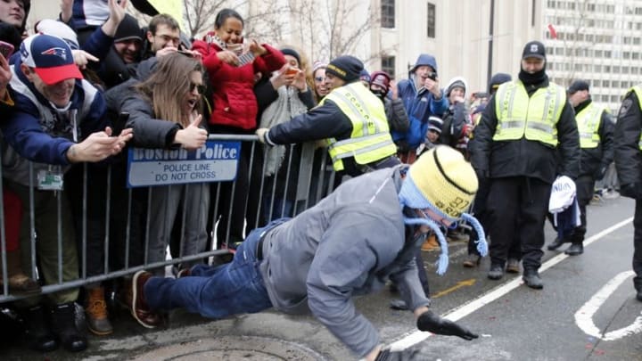 Feb 4, 2015; Boston, MA, USA; New England Patriots tight end Rob Gronkowski (87) does some push-ups in front of fans during the Super Bowl XLIX-New England Patriots Parade. Mandatory Credit: Greg M. Cooper-USA TODAY Sports
