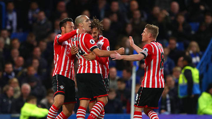 LONDON, ENGLAND - APRIL 25: Oriol Romeu of Southampton (14) celebrates as he scores their first goal with team mates during the Premier League match between Chelsea and Southampton at Stamford Bridge on April 25, 2017 in London, England. (Photo by Clive Rose/Getty Images)