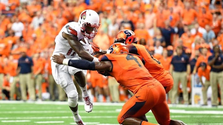 Sep 9, 2016; Syracuse, NY, USA; Louisville Cardinals wide receiver James Quick (17) runs with the ball after a catch in front of Syracuse Orange linebacker Zaire Franklin (4) and defensive back Antwan Cordy (8) during the fourth quarter at the Carrier Dome. Louisville defeated Syracuse 62-28. Mandatory Credit: Rich Barnes-USA TODAY Sports