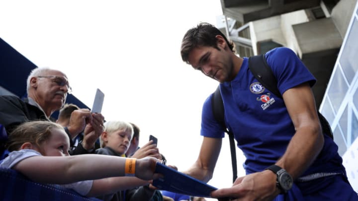 LONDON, ENGLAND - SEPTEMBER 15: Marcos Alonso of Chelsea signs autographs ahead of the Premier League match between Chelsea FC and Cardiff City at Stamford Bridge on September 15, 2018 in London, United Kingdom. (Photo by Dan Istitene/Getty Images)
