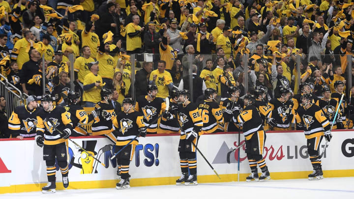 PITTSBURGH, PA – APRIL 14: Garrett Wilson #10 of the Pittsburgh Penguins celebrates with teammates on the bench after scoring a goal during the first period in Game Three of the Eastern Conference First Round against the New York Islanders during the 2019 NHL Stanley Cup Playoffs at PPG PAINTS Arena on April 14, 2019 in Pittsburgh, Pennsylvania. (Photo by Justin Berl/Getty Images)