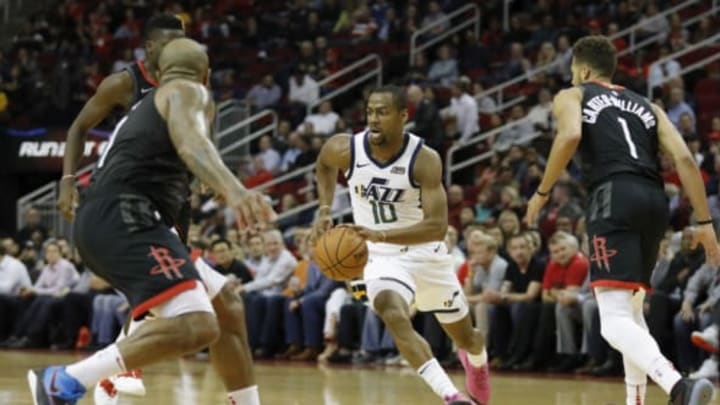 HOUSTON, TX – OCTOBER 24: Alec Burks #10 of the Utah Jazz drives to the basket defended by PJ Tucker #17 of the Houston Rockets and Michael Carter-Williams #1 in the first half at Toyota Center on October 24, 2018 in Houston, Texas. NOTE TO USER: User expressly acknowledges and agrees that, by downloading and or using this Photograph, user is consenting to the terms and conditions of the Getty Images License Agreement. (Photo by Tim Warner/Getty Images)