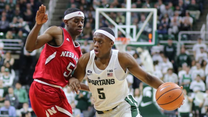 EAST LANSING, MI - DECEMBER 3: Cassius Winston #5 of the Michigan State Spartans drives to the basket against Glynn Watson Jr. #5 of the Nebraska Cornhuskers at Breslin Center on December 3, 2017 in East Lansing, Michigan. (Photo by Rey Del Rio/Getty Images)