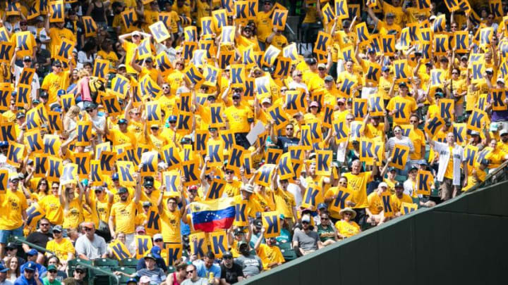 SEATTLE, WA - JULY 09: The King's Court holds up their 'K' signs, and one Venezuelan flag, as Felix Hernandez