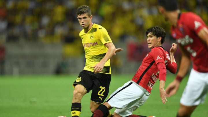 SAITAMA, JAPAN - JULY 15: Christian Pulisic of Borussia Dortmund passes the ball during the preseason friendly match between Urawa Red Diamonds and Borussia Dortmund at Saitama Stadium on July 15, 2017 in Saitama, Japan. (Photo by Atsushi Tomura/Getty Images)