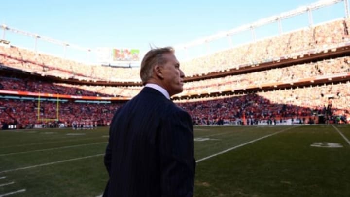 January 19, 2014; Denver, CO, USA; Denver Broncos executive vice president of football operations John Elway late in the fourth quarter against the New England Patriots in the 2013 AFC Championship football game at Sports Authority Field at Mile High. Mandatory Credit: Ron Chenoy-USA TODAY Sports