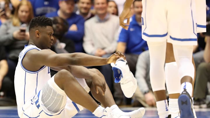 DURHAM, NORTH CAROLINA - FEBRUARY 20: Zion Williamson #1 of the Duke Blue Devils reacts after falling as his shoe breaks during their game against the North Carolina Tar Heels at Cameron Indoor Stadium on February 20, 2019 in Durham, North Carolina. (Photo by Streeter Lecka/Getty Images)