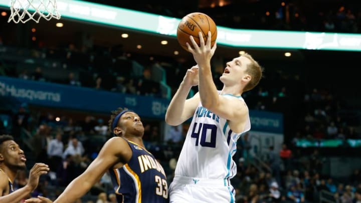 Nov 7, 2016; Charlotte, NC, USA; Charlotte Hornets forward Cody Zeller (40) goes up for a shot against Indiana Pacers center Myles Turner (33) in the second half at Spectrum Center. The Hornets defeated the Pacers 122-100. Mandatory Credit: Jeremy Brevard-USA TODAY Sports