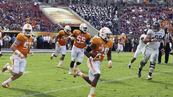 Jan 1, 2016; Tampa, FL, USA; Tennessee Volunteers defensive back Evan Berry (29) runs the ball back for a touchdown against the Northwestern Wildcats in the second half at the 2016 Outback Bowl at Raymond James Stadium. Tennessee defeated Northwestern 45-6. Mandatory Credit: Mark Zerof-USA TODAY Sports