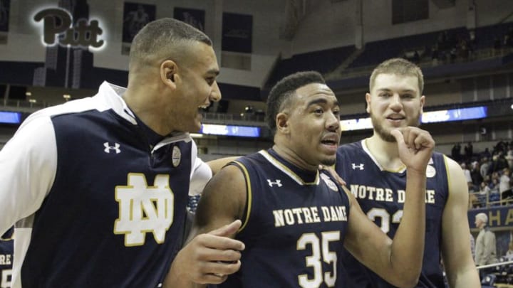 Dec 31, 2016; Pittsburgh, PA, USA; Notre Dame Fighting Irish forward Austin Torres (L), forward Bonzie Colson (35) and forward Martinas Geben (23) celebrate after defeating the Pittsburgh Panthers in overtime at the Petersen Events Center. Notre Dame won 78-77 in overtime. Mandatory Credit: Charles LeClaire-USA TODAY Sports