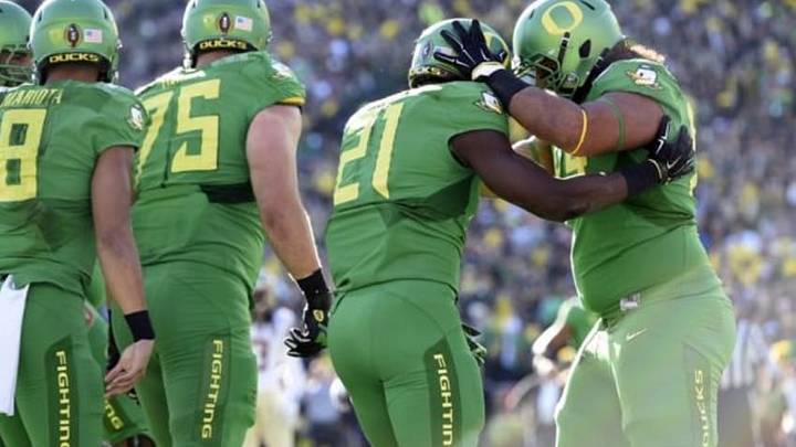 Jan 1, 2015; Pasadena, CA, USA; Oregon Ducks running back Royce Freeman (21) celebrates with teammates after scoring a touchdown against the Florida State Seminoles during the first half in the 2015 Rose Bowl college football game at Rose Bowl. Mandatory Credit: Gary Vasquez-USA TODAY Sports