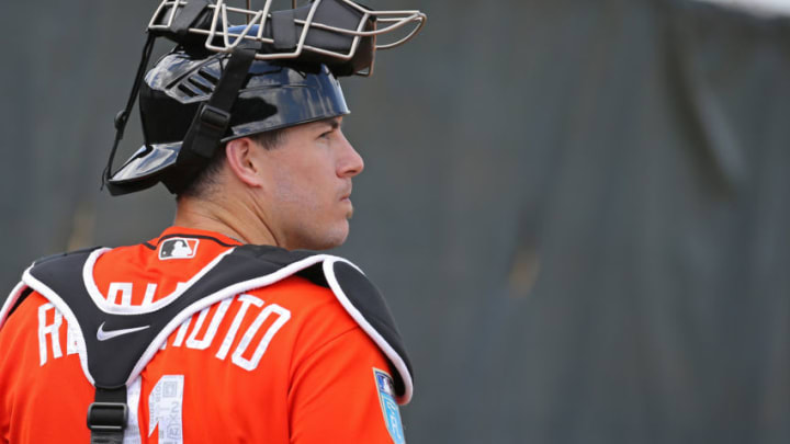 Miami Marlins catcher J.T. Realmuto looks on during the spring training baseball workouts for pitchers and catchers on Wednesday, February 14, 2018 at Roger Dean Stadium in Jupiter, Fla. (David Santiago/Miami Herald/TNS via Getty Images)