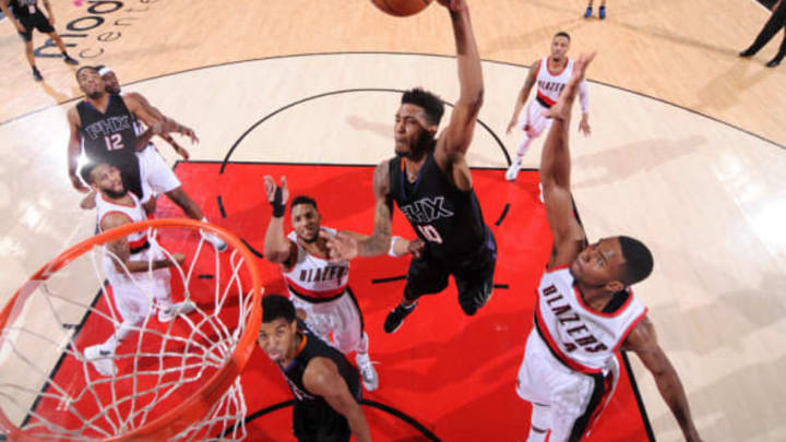 PORTLAND, OR – APRIL 1: Derrick Jones Jr. #10 of the Phoenix Suns dunks the ball during the game against the Portland Trail Blazers on April 1, 2017 at the Moda Center in Portland, Oregon. NOTE TO USER: User expressly acknowledges and agrees that, by downloading and or using this Photograph, user is consenting to the terms and conditions of the Getty Images License Agreement. Mandatory Copyright Notice: Copyright 2017 NBAE (Photo by Sam Forencich/NBAE via Getty Images)