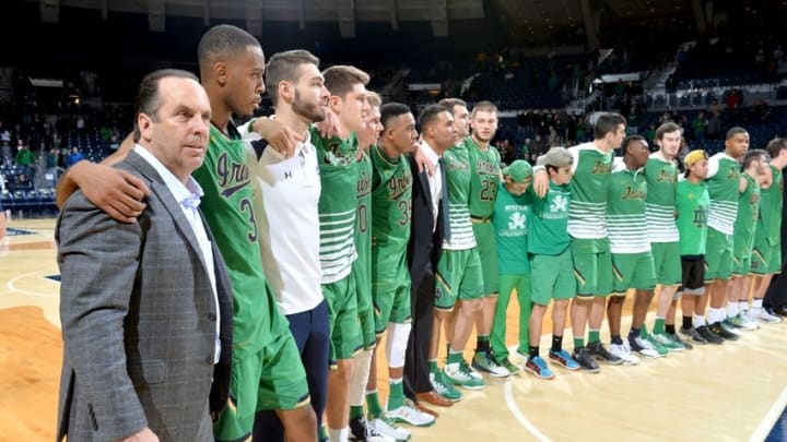 Nov 29, 2016; South Bend, IN, USA; Notre Dame Fighting Irish head coach Mike Brey stands with his players for the Notre Dame Alma Mater after Notre Dame defeated the Iowa Hawkeyes 92-78 at the Purcell Pavilion. Mandatory Credit: Matt Cashore-USA TODAY Sports