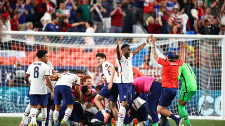 U.S. players pile on goalie Ethan Horvath after defeating Mexico to win the Concacaf Nations League in overtime. (Photo by Jamie Schwaberow/ISI Photos/Getty Images)