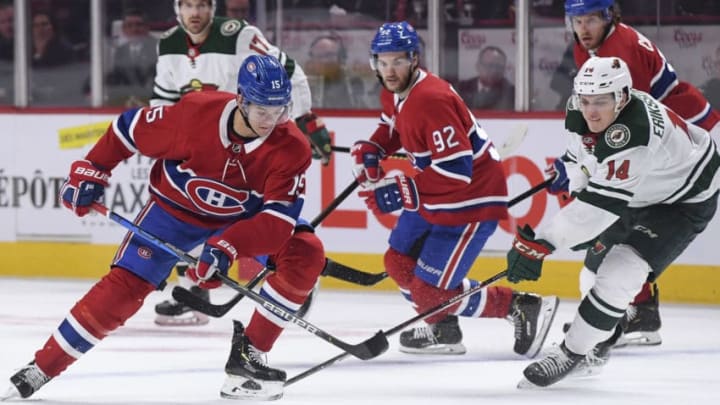 MONTREAL, QC - OCTOBER 17: Jesperi Kotkaniemi #15 of the Montreal Canadiens controls the puck while being challenged by Joel Eriksson Ek #14 of the Minnesota Wild in the NHL game at the Bell Centre on October 17, 2019 in Montreal, Quebec, Canada. (Photo by Francois Lacasse/NHLI via Getty Images)