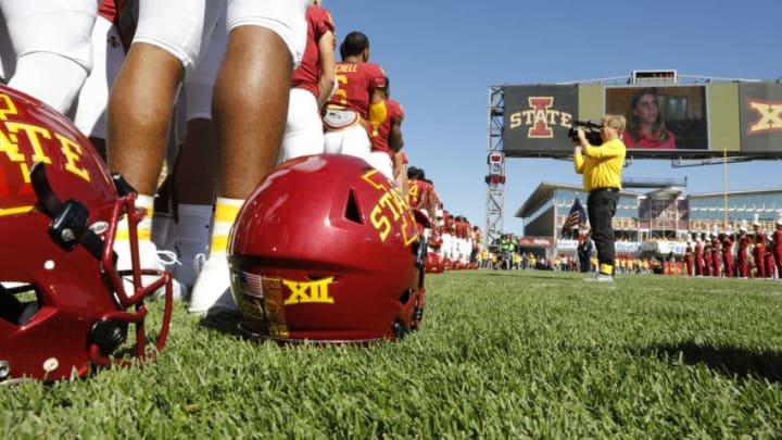 AMES, IA - SEPTEMBER 22: During a pre-game moment of silence the Iowa State Cyclones and the Akron Zips wear CBA helmet decals to honor Celia Barquin Arozamena, (pictured on the jumbotron), at Jack Trice Stadium on September 22, 2018 in Ames, Iowa. Celia Barquin Arozamena, Iowa States 2018 Big 12 Women's Golf Champion, was murdered Monday September 17th while playing golf on a course near the college. (Photo by David Purdy/Getty Images)