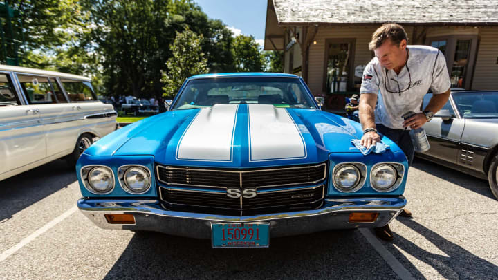 Scott Jankowski of Hartland polishes his beautifully restored 1970 Chevelle SS during the Old Falls Village Car Show in Menomonee Falls on Saturday, September 19, 2020. The annual event features a beer garden, food, beverages, door prizes and more.Lcn Nwn Carshow 0464