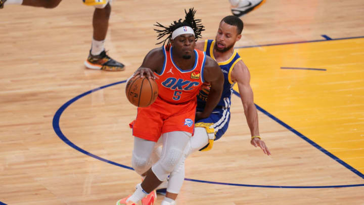 OKC Thunder guard Luguentz Dort (5) is fouled by Golden State Warriors guard Stephen Curry (30): Cary Edmondson-USA TODAY Sports