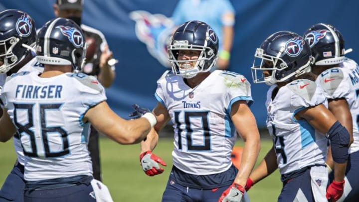 NASHVILLE, TN - SEPTEMBER 20: Adam Humphries #10 of the Tennessee Titans celebrates with teammates after catching a touchdown pass during a game against the Jacksonville Jaguars at Nissan Stadium on September 20, 2020 in Nashville, Tennessee. The Titans defeated the Jaguars 33-30. (Photo by Wesley Hitt/Getty Images)