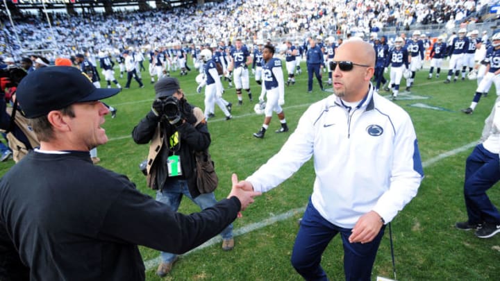 STATE COLLEGE, PA - NOVEMBER 21: James Franklin head coach of the Penn State Nittany Lions congratulates Jim Harbaugh head coach of the Michigan Wolverines after the game at Beaver Stadium on November 21, 2015 in State College, Pennsylvania. The Wolverines won 28-16. (Photo by Evan Habeeb/Getty Images)
