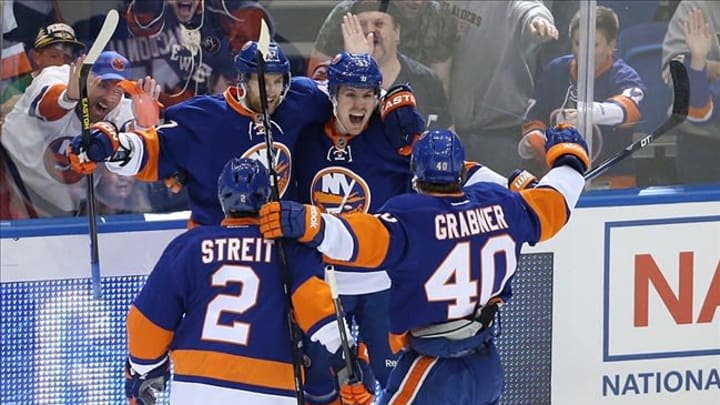 May 5, 2013; Uniondale, NY, USA; New York Islanders center Casey Cizikas (53) celebrates scoring with teammates during the first period against the Pittsburgh Penguins in game three of the first round of the 2013 Stanley Cup playoffs at Nassau Veterans Memorial Coliseum. Mandatory Credit: Anthony Gruppuso-USA TODAY Sports