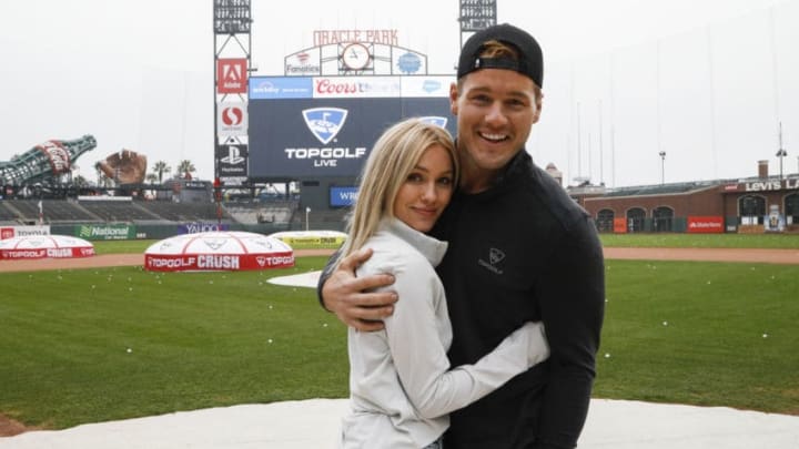 SAN FRANCISCO, CA - NOVEMBER 07: Cassie Randolph (L) and Colton Underwood join thousands in Topgolf's Guinness Book World Record attempt for most golf balls hit simultaneously at Oracle Park in San Francisco, California and all Topgolf venues around the world on November 7, 2019. (Photo by Kimberly White/Getty Images for Topgolf Entertainment Group)