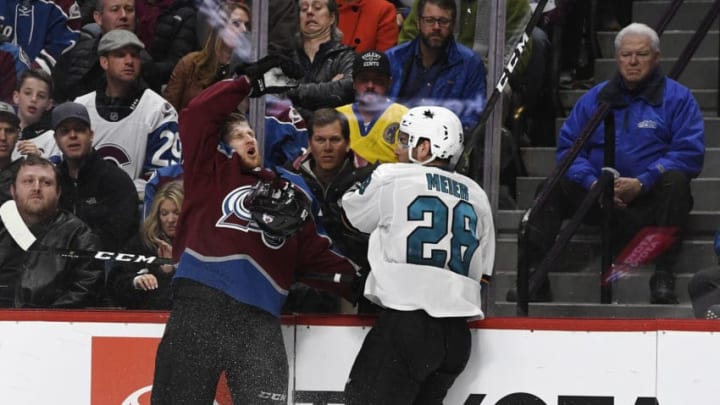 DENVER, CO - APRIL 30: Colorado Avalanche center Nathan MacKinnon (29) has his helmet ripped off by San Jose Sharks right wing Timo Meier (28) in the third period at the Pepsi Center during the game three of the Stanley Cup Western Conference semifinals April 30, 2019. The Avalanche lost 4-2. (Photo by Andy Cross/MediaNews Group/The Denver Post via Getty Images)