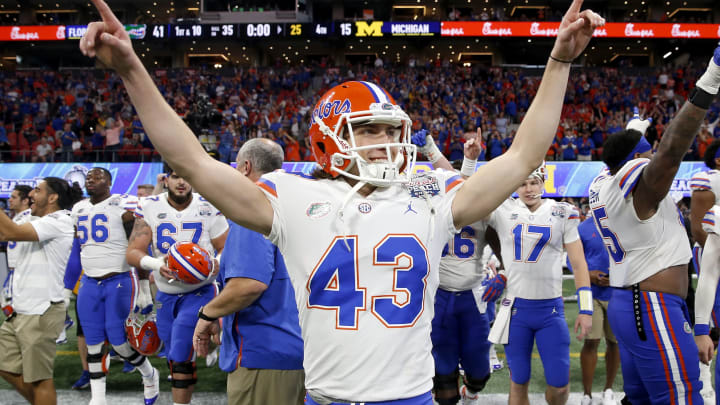 ATLANTA, GEORGIA – DECEMBER 29: Tommy Townsend #43 of the Florida Gators celebrates after his teams win over the Michigan Wolverines during the Chick-fil-A Peach Bowl at Mercedes-Benz Stadium on December 29, 2018 in Atlanta, Georgia. The Gators defeated the Wolverines 41-15. (Photo by Mike Zarrilli/Getty Images)