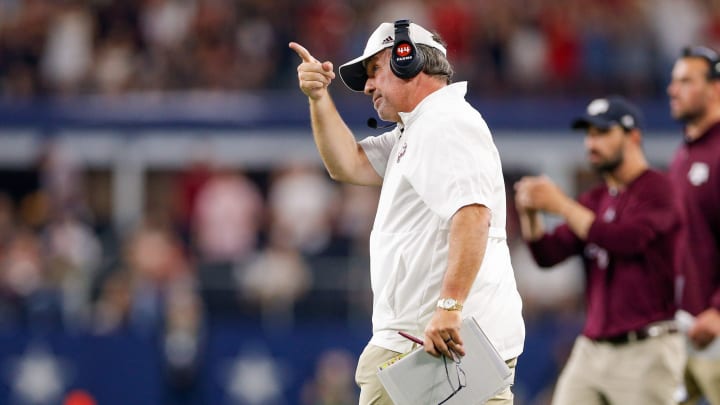 Sep 24, 2022; Arlington, Texas, USA; Texas A&M Aggies head coach Jimbo Fisher points at the scoreboard during the second quarter against the Arkansas Razorbacks at AT&T Stadium. Mandatory Credit: Andrew Dieb-USA TODAY Sports