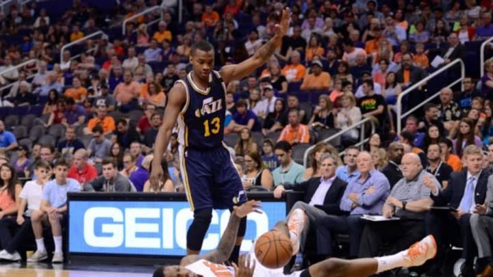 Apr 4, 2015; Phoenix, AZ, USA; Utah Jazz guard Elijah Millsap (13) fouls Phoenix Suns guard Archie Goodwin (20) during the first half at US Airways Center. Mandatory Credit: Joe Camporeale-USA TODAY Sports