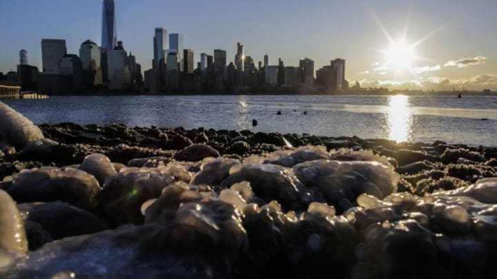 EXCHANGE PLACE, NJ - JANUARY 06: Ice floats along the Hudson River as the skyline of New York City and One world Trade Center are seen during freeze temperatures on January 06, 2018 in Exchange Place, New Jersey. The extreme conditions suffered across the United States are as a result of the 'bomb cyclone' brought along by Storm Grayson. (Photo by Eduardo Munoz Alvarez/Getty Images)