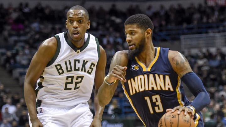 Mar 10, 2017; Milwaukee, WI, USA; Indiana Pacers forward Paul George (13) drives for the basket against Milwaukee Bucks guard Khris Middleton (22) in the second quarter at BMO Harris Bradley Center. Mandatory Credit: Benny Sieu-USA TODAY Sports