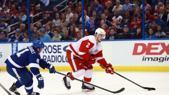 Mar 22, 2016; Tampa, FL, USA; Detroit Red Wings defenseman Brendan Smith (2) skates with the puck as Tampa Bay Lightning center Jonathan Marchessault (81) defends during the third period at Amalie Arena. Tampa Bay Lightning defeated the Detroit Red Wings 6-2. Mandatory Credit: Kim Klement-USA TODAY Sports