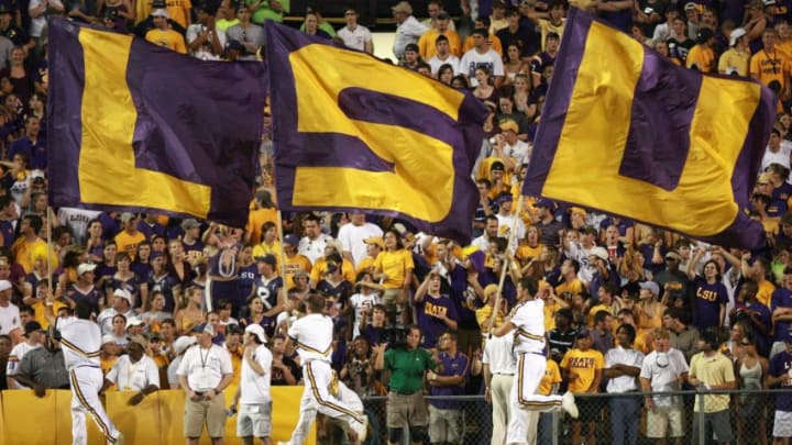 BATON ROUGE, LA - OCTOBER 06: Cheerleaders of the LSU Tigers carries flags against the Florida Gators at Tiger Stadium on October 6 , 2007 in Baton Rouge, Louisiana. LSU defeated Florida 28-24. (Photo by Doug Benc/Getty Images)