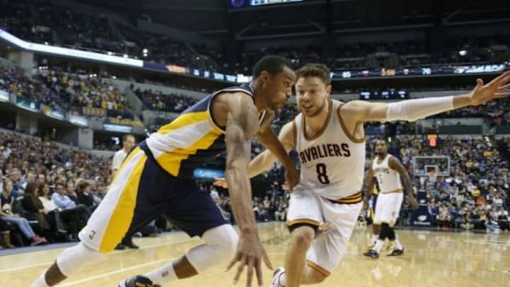 Feb 27, 2015; Indianapolis, IN, USA; Indiana Pacers guard George Hill (3) drives to the basket against Cleveland Cavaliers guard Matthew Dellavedova (8) at Bankers Life Fieldhouse. Indiana defeats Cleveland 93-86. Mandatory Credit: Brian Spurlock-USA TODAY Sports