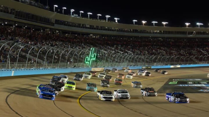 PHOENIX, ARIZONA - NOVEMBER 08: Stewart Friesen, driver of the #52 Halmar International Chevrolet, and Austin Hill, driver of the #16 AISIN Group Toyota, lead the field to start the NASCAR Gander Outdoors Truck Series Lucas Oil 150 at ISM Raceway in Phoenix on November 08, 2019 in Phoenix, Arizona. (Photo by Jared C. Tilton/Getty Images)