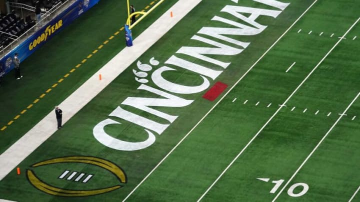 Cincinnati Bearcats logo featured in the end zone ahead of the College Football Playoff semifinal. The Enquirer.