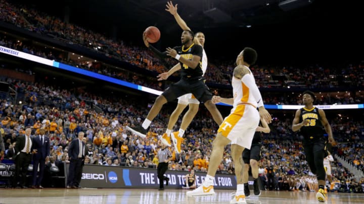 COLUMBUS, OHIO - MARCH 24: Isaiah Moss #4 of the Iowa Hawkeyes goes up for a shot against Grant Williams #2 of the Tennessee Volunteers during their game in the Second Round of the NCAA Basketball Tournament at Nationwide Arena on March 24, 2019 in Columbus, Ohio. (Photo by Gregory Shamus/Getty Images)