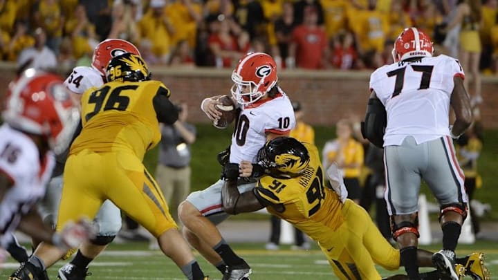 Sep 17, 2016; Columbia, MO, USA; Georgia Bulldogs quarterback Jacob Eason (10) is sacked by Missouri Tigers defensive end Charles Harris (91) in the first half at Faurot Field. Mandatory Credit: John Rieger-USA TODAY Sports