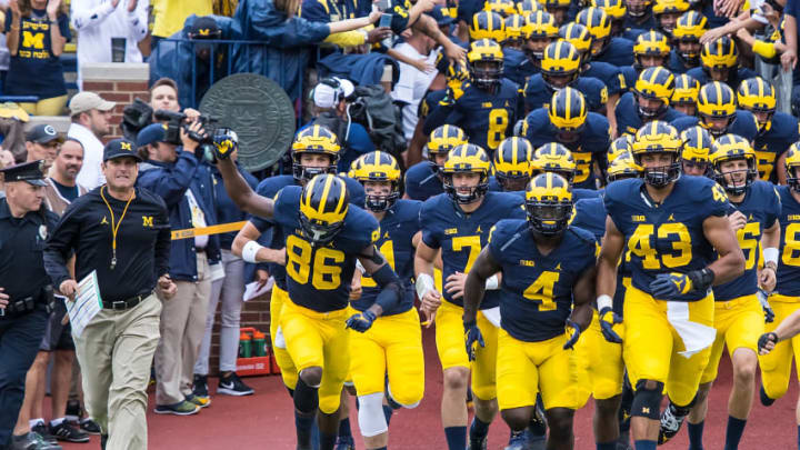 DETROIT, MI - SEPTEMBER 10: Head coach Jim Harbaugh of the Michigan Wolverines lead his team onto the field before a college football game against the UCF Knights at Michigan Stadium on September 10, 2016 in Ann Arbor, Michigan. (Photo by Dave Reginek/Getty Images)