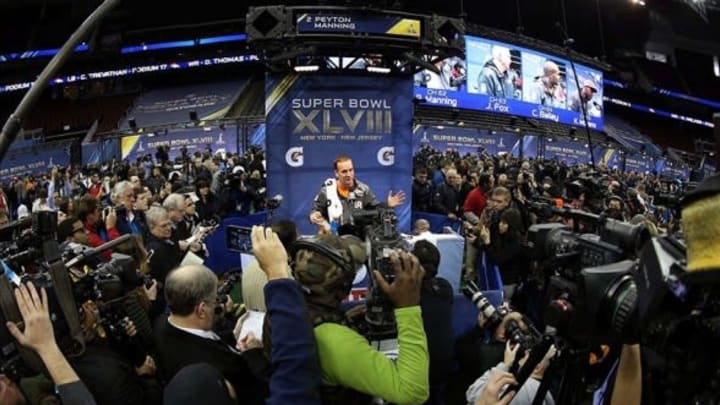 Jan 28, 2014; Newark, NJ, USA; Denver Broncos quarterback Peyton Manning is interviewed during Media Day for Super Bowl XLIII at Prudential Center. Mandatory Credit: Brad Penner-USA TODAY Sports