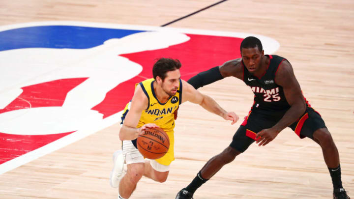 T.J. McConnell #9 of the Indiana Pacers drives against Kendrick Nunn #25 of the Miami Heat. (Photo by Kim Klement - Pool/Getty Images)
