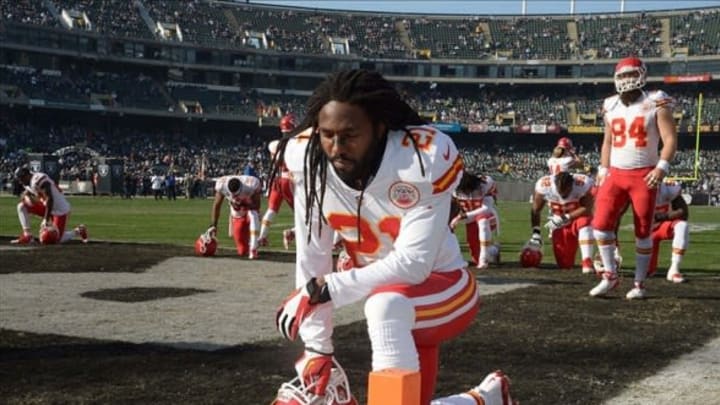 Dec 15, 2013; Oakland, CA, USA; Kansas City Chiefs cornerback Dunta Robinson (21) kneel prior to the game against the Oakland Raiders at O.co Coliseum. The Chiefs won 56-31. Mandatory Credit: Kirby Lee-USA TODAY Sports