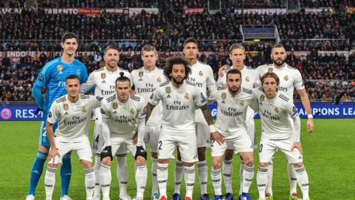 (From L, Front) Real Madrid's Spanish midfielder Lucas Vazquez, Real Madrid's Welsh forward Gareth Bale, Real Madrid's Brazilian defender Marcelo, Real Madrid's Spanish defender Dani Carvajal and Real Madrid's Croatian midfielder Luka Modric and (From L, Rear) Real Madrid's Belgian goalkeeper Thibaut Courtois, Real Madrid's Spanish defender Sergio Ramos, Real Madrid's German midfielder Toni Kroos, Real Madrid's French defender Raphael Varane, Real Madrid's Spanish miedfieder Marcos Llorente and Real Madrid's French forward Karim Benzema pose for a team photo prior the UEFA Champions League group G football match AS Rome vs Real Madrid on November 27, 2018 at the Olympic stadium in Rome. (Photo by Tiziana FABI / AFP) (Photo credit should read TIZIANA FABI/AFP/Getty Images)