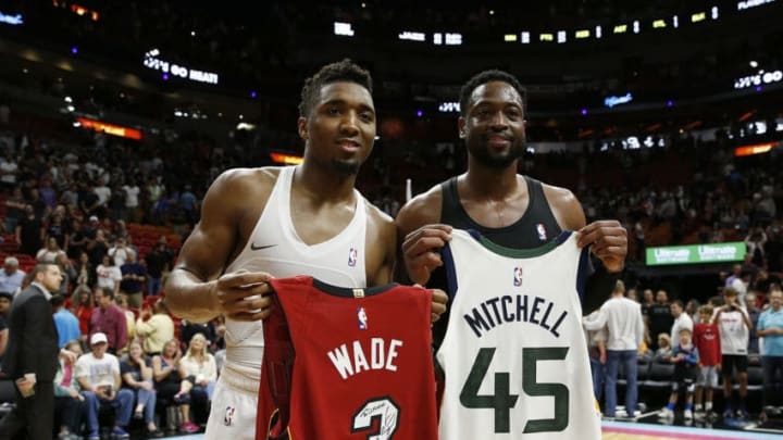 MIAMI, FL - DECEMBER 02: Donovan Mitchell #45 of the Utah Jazz and Dwyane Wade #3 of the Miami Heat exchange jerseys after the game at American Airlines Arena on December 2, 2018 in Miami, Florida. (Photo by Michael Reaves/Getty Images)