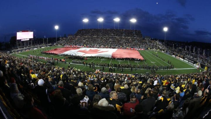 The national athem is played prior to play between the Toronto Argonauts and the Hamilton Tiger-cats in a CFL football game at Tim Hortons Field. (Photo by Claus Andersen/Getty Images)