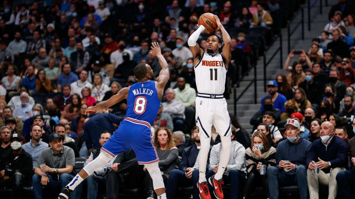 8 Feb. 2022; Denver, Colorado, USA; Denver Nuggets guard Monte Morris (11) attempts a shot as New York Knicks guard Kemba Walker (8) defends in the second quarter at Ball Arena. (Isaiah J. Downing-USA TODAY Sports)