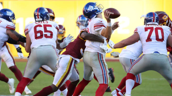 Nov 8, 2020; Landover, Maryland, USA; New York Giants quarterback Daniel Jones (8) is sacked by Washington Football Team safety Kamren Curl (31) in the fourth quarter at FedExField. Mandatory Credit: Geoff Burke-USA TODAY Sports