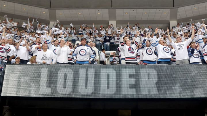 WINNIPEG, MB - APRIL 13: Winnipeg Jets fans rise to their feet and cheer during a third period stoppage in play between the Jets and the Minnesota Wild in Game Two of the Western Conference First Round during the 2018 NHL Stanley Cup Playoffs at the Bell MTS Place on April 13, 2018 in Winnipeg, Manitoba, Canada. (Photo by Jonathan Kozub/NHLI via Getty Images)
